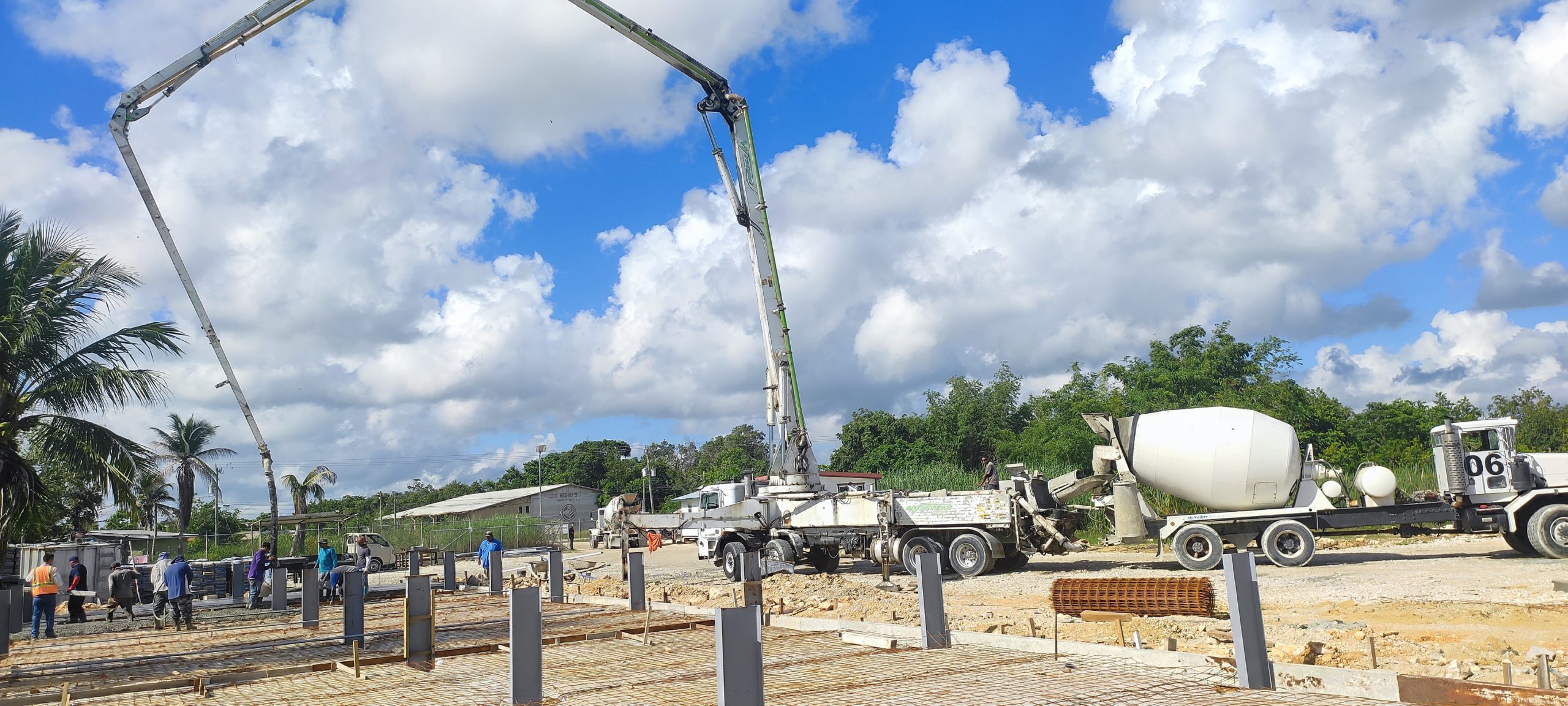 Concrete pump truck pouring garage floor