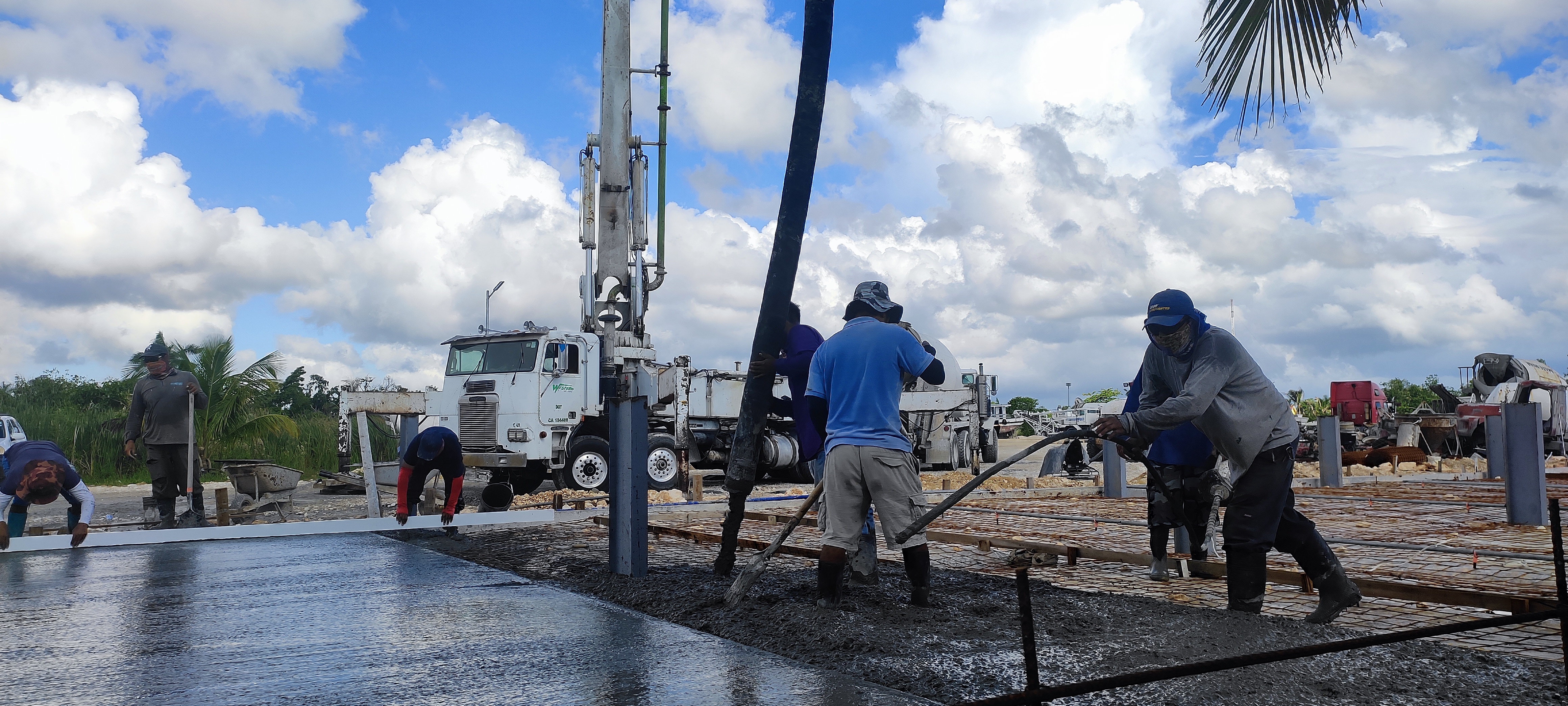 Concrete pump truck operating on island jobsite